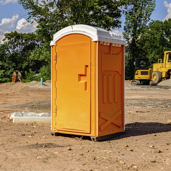 how often are the portable restrooms cleaned and serviced during a rental period in Bedford